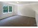 Bedroom featuring a window and neutral walls and carpet at 177 Jacobs Woods Cir, Troutman, NC 28166