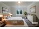 Calming bedroom with neutral decor, a large window, and soft textures at 177 Jacobs Woods Cir, Troutman, NC 28166