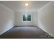 Bedroom featuring a window and neutral walls and carpet at 177 Jacobs Woods Cir, Troutman, NC 28166