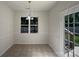 Eat-in kitchen with tile flooring and lots of natural light at 177 Jacobs Woods Cir, Troutman, NC 28166