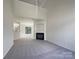 Spacious living room with fireplace, neutral walls, and carpet at 177 Jacobs Woods Cir, Troutman, NC 28166