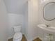 Powder room features a pedestal sink and neutral finishes at 177 Jacobs Woods Cir, Troutman, NC 28166