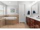 Bathroom with a soaking tub, tiled floor, and vanity at 19143 Juanita Ln, Cornelius, NC 28031