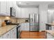 Well-equipped kitchen with stainless steel appliances, granite countertops, and ample cabinet space at 19143 Juanita Ln, Cornelius, NC 28031