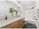 Bright bathroom features a double sink vanity, white subway tile, and modern fixtures at 2006 St John St, Charlotte, NC 28216