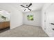 Carpeted bedroom with en suite bathroom features a window with lush green views at 2006 St John St, Charlotte, NC 28216