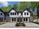 Stunning new construction exterior featuring a modern design and inviting front yard at 2006 St John St, Charlotte, NC 28216