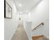 Bright hallway features modern wooden handrails and stylish carpet flooring at 2006 St John St, Charlotte, NC 28216