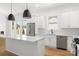 Modern kitchen featuring stainless steel appliances, white countertops, and a central island at 2006 St John St, Charlotte, NC 28216