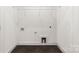 Bright laundry room features stylish tile flooring and convenient utility connections at 2006 St John St, Charlotte, NC 28216