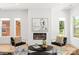 Chic living room with fireplace feature, hardwood floors, and an inviting seating area at 2006 St John St, Charlotte, NC 28216