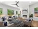 Inviting living room featuring modern fireplace, comfortable seating, and abundant natural light at 2006 St John St, Charlotte, NC 28216