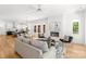 Open living space with a fireplace, modern lighting, and seamless flow into the kitchen area at 2006 St John St, Charlotte, NC 28216