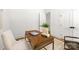Stylish home office features a wooden desk, chair, and ample natural light at 2006 St John St, Charlotte, NC 28216