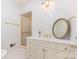 This primary bath offers a glass enclosed shower, vanity and gold hardware at 208 Huntley Pl, Charlotte, NC 28207