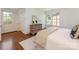 Bedroom with light colored walls, hardwood floors and an abundance of natural light at 208 Huntley Pl, Charlotte, NC 28207