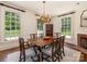 Dining room with beautiful windows and a modern light fixture at 208 Huntley Pl, Charlotte, NC 28207