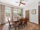 A dining room features a wooden table with seating and lots of natural light at 208 Huntley Pl, Charlotte, NC 28207