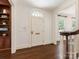 Elegant entryway with hardwood floors and arched doorway and trim at 208 Huntley Pl, Charlotte, NC 28207