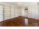 Office space with custom built-in shelves, hardwood floors and a window seat at 208 Huntley Pl, Charlotte, NC 28207