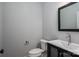 A powder bathroom has a modern vanity with a sink, a toilet, and a mirror at 2313 Ivey Church Rd, Maiden, NC 28650