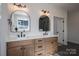 A modern bathroom has double sinks and sleek fixtures, combining style and functionality at 2313 Ivey Church Rd, Maiden, NC 28650