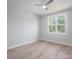 Comfortable bedroom with neutral walls, laminate flooring, ceiling fan, and bright window view at 2313 Ivey Church Rd, Maiden, NC 28650
