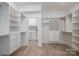A well-organized walk-in closet offers ample storage with custom shelving and drawers at 2313 Ivey Church Rd, Maiden, NC 28650