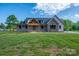 A view of the home's exterior featuring a welcoming front porch and well-manicured front lawn at 2313 Ivey Church Rd, Maiden, NC 28650