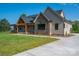 Charming single-Gathering home with beautiful stone accents and covered front porch, set on a lush green lawn at 2313 Ivey Church Rd, Maiden, NC 28650