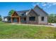 Beautifully crafted home with stone and siding exterior, a covered porch, and a spacious, well-kept lawn at 2313 Ivey Church Rd, Maiden, NC 28650