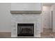 A modern fireplace with a wooden mantel and stone surround adds warmth to the living space at 2313 Ivey Church Rd, Maiden, NC 28650