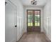 Bright foyer with wood floors and stylish double doors leading to the outside at 2313 Ivey Church Rd, Maiden, NC 28650