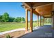 Spacious covered porch with timber posts, offering picturesque views at 2313 Ivey Church Rd, Maiden, NC 28650