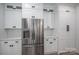 Bright kitchen with stainless steel refrigerator, white cabinets, black hardware, and subway tile backsplash at 2313 Ivey Church Rd, Maiden, NC 28650