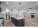 Spacious kitchen with a large island, stainless steel appliances, and open layout flowing into the living room at 2313 Ivey Church Rd, Maiden, NC 28650