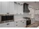 A close up of the kitchen featuring white cabinetry, stainless steel appliances, gas stove, and subway tile backsplash at 2313 Ivey Church Rd, Maiden, NC 28650
