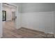 This room has paneled walls and neutral paint giving the space a classic look at 2313 Ivey Church Rd, Maiden, NC 28650