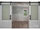An office with sliding doors and a window gives the room a light and open feel at 2313 Ivey Church Rd, Maiden, NC 28650