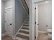 A modern staircase with wood treads leads to the upper level of the home at 2313 Ivey Church Rd, Maiden, NC 28650