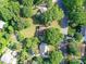 Birds-eye-view of a home surrounded by mature trees in a residential neighborhood at 2315 Lawton Bluff Rd, Charlotte, NC 28226