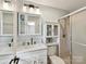 Modern bathroom featuring white vanity, sink, shower with glass doors, and tiled floors at 2315 Lawton Bluff Rd, Charlotte, NC 28226