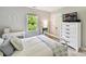 Bedroom with white walls, a metal frame bed, window with view, and TV at 2315 Lawton Bluff Rd, Charlotte, NC 28226