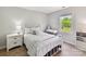 Well-lit bedroom with a metal frame bed, white walls, and a large window at 2315 Lawton Bluff Rd, Charlotte, NC 28226