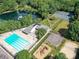 Aerial view of community pool, tennis courts, playground, and lake at 2315 Lawton Bluff Rd, Charlotte, NC 28226