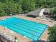Large community swimming pool surrounded by lounge chairs and umbrellas at 2315 Lawton Bluff Rd, Charlotte, NC 28226