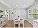 Bright dining area with a white table set for four, lots of natural light and neutral decor at 2315 Lawton Bluff Rd, Charlotte, NC 28226