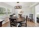 Elegant dining room featuring a round table, chandelier, and natural light, perfect for Gathering gatherings at 2315 Lawton Bluff Rd, Charlotte, NC 28226