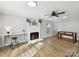 Bright living room with fireplace, desk, and hardwood floors provides a comfortable space for living at 2315 Lawton Bluff Rd, Charlotte, NC 28226