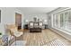 Inviting living room with hardwood floors, a comfortable sofa, and natural light, creating a warm and welcoming space at 2315 Lawton Bluff Rd, Charlotte, NC 28226